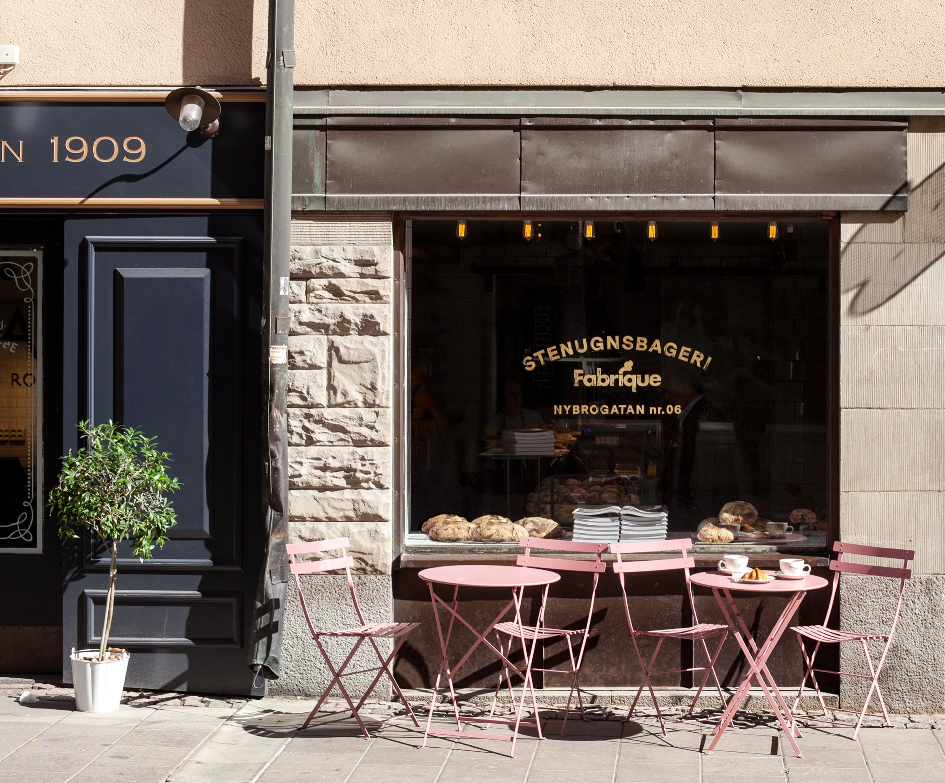 The Fabrique shop on Nybrogatan, the name painted on the glass and tables out on the pavement.