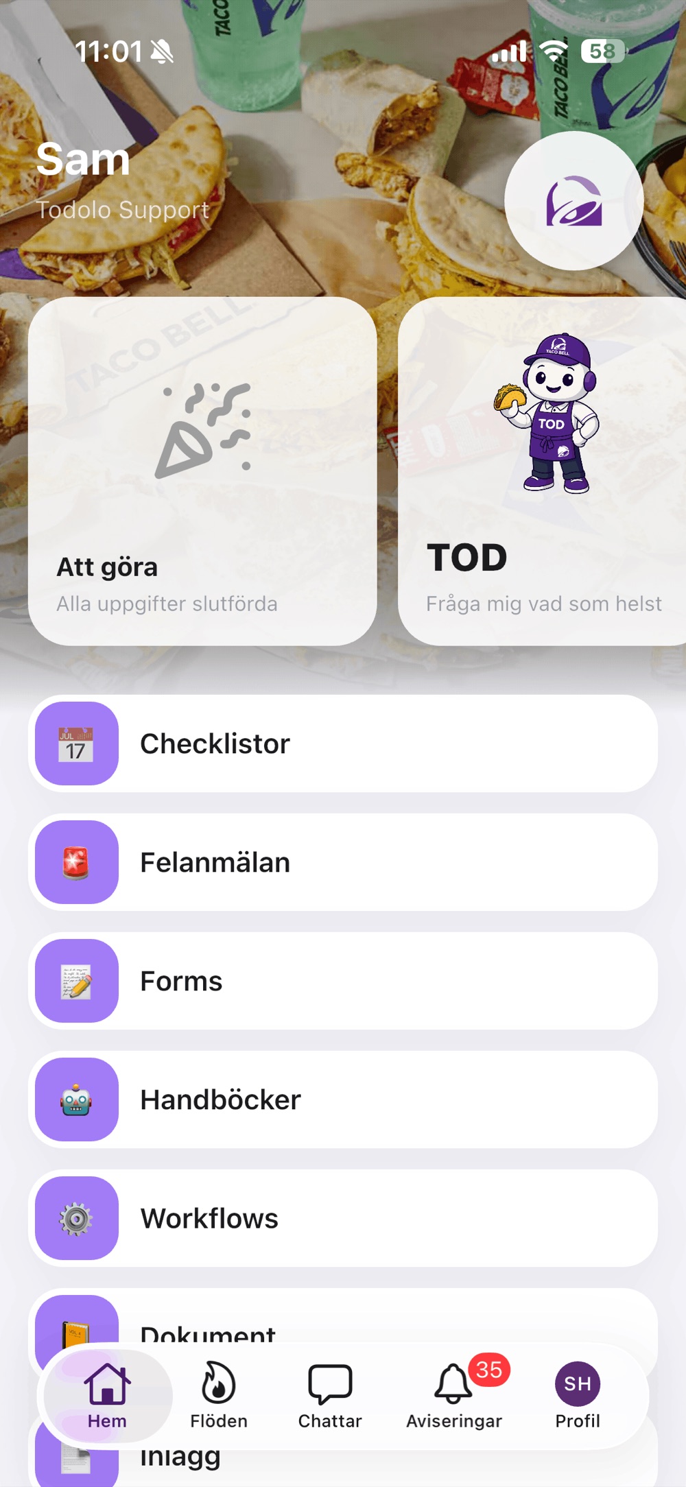Taco Bells Todolo-hemskärm: lila modulikoner, Taco Bell-märket och TOD i Taco Bell-uniform.